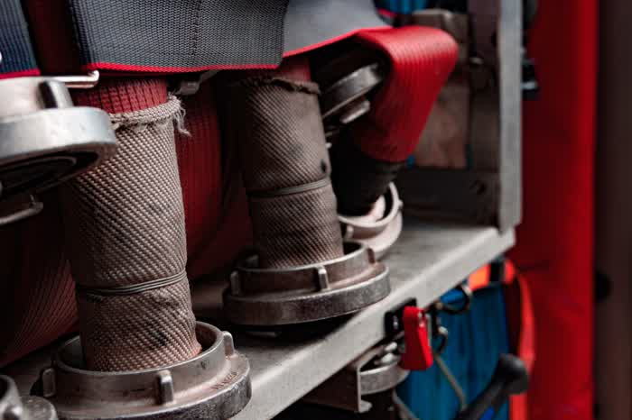 Fire hoses on a fire truck shelf