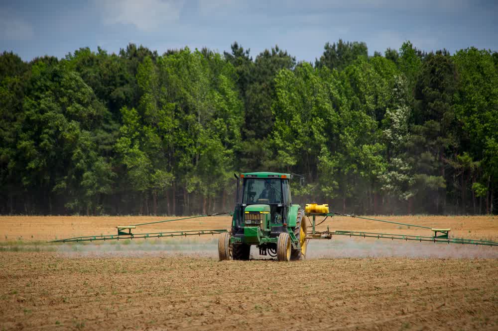 A tractor working a farm field