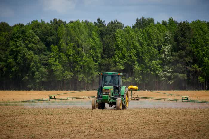 A tractor working a farm field