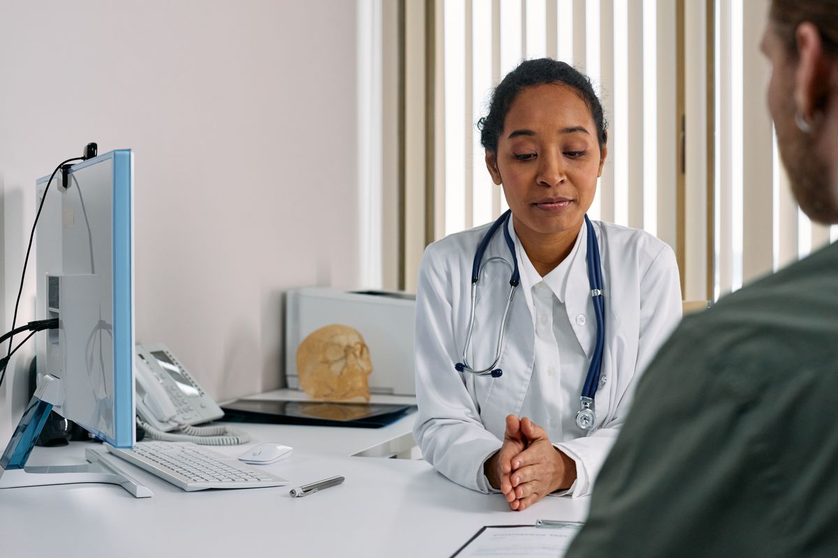 A female doctor consulting a patient in a modern medical office setting