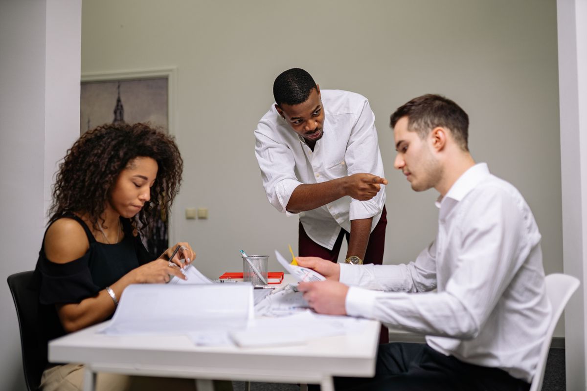 Manager instructing employees