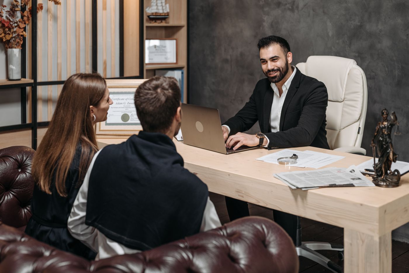 A lawyer consulting clients in an upscale law office